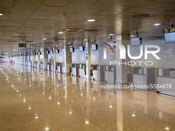 Empty Barcelona El Prat airport after the state of alarm imposed by the spanish government and measure of lockdown the population of Catalon...