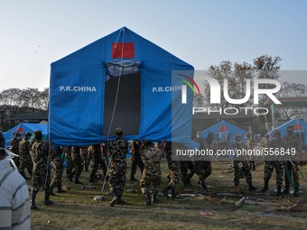 KATHMANDU, NEPAL - Nepalese army personals perpaer tent for the earthquake victims in the camp in Kathmandu, May 1, 2015. (