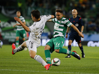 Sporting's midfielder Diego Capel  (R) vies for the ball with Nacional's defender Nuno Campos (R)  during the Portuguese League  football ma...