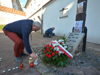 People light candles in memory of victimes of the Smolensk 2010 carsh disaster at the Cross of Katyn in Krakow.
In the early hours of the mo...