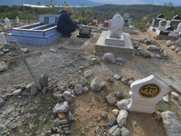 A number of Muslims remember and pray for their families who have died and are buried in the mass graves of victims of the earthquake, tsuna...
