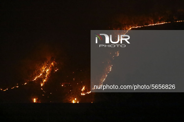 A shows a fire spreading at a mountain in the southeastern city of Andong, South Korea on April 26, 2020. Firefighters on Saturday continued...