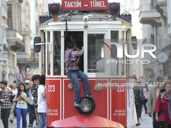 A tram passing on the busy İstiklal Avenue in the Beyoğlu quarter of Istanbul. Istanbul, Turkey, on May 4, 2015. (