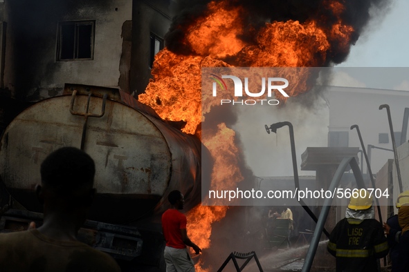 Firemen try to put out fire on a burning tanker at Ogba in Lagos. Amid Coronavirus (COVID-19) pandemic lockdown a fuel taker caught fire, bu...