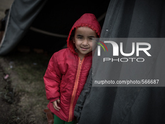 A kid is standing in front of his tent. Tudikhel temporary shelter, Kathmandu, 30th April 2015. The official death toll climbed to over 7,20...