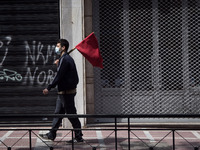 People wearing mask protest on International Worker's Day during the curfew due to Coronavirus (Covid-19) pandemic in Athens, Greece on May...