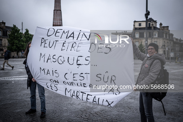 May Day in Bordeaux France, on May 1, 2020, a small group of people demonstrate in the street during the confinement before being checked by...