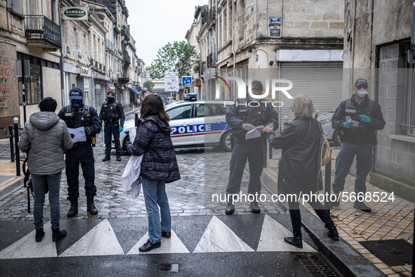 Police check people demonstrating for May Day in Bordeaux, France, on May 1, 2020 during lockdown. 