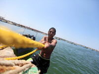 Palestinian young man in the Mediterranean as he was enjoying a swim on a hot day at the port in Gaza City, on May 5, 2015. (