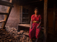 Kanchi Achami is sitting inside her destroyed  house. Dhading, Nepal. May 5, 2015 (