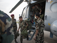 KATHAMNDU, NEPAL-- May 6, 2015--Crew unload from an Indian Air Force helicopter that picked up injured people in a remote area of Dhading di...