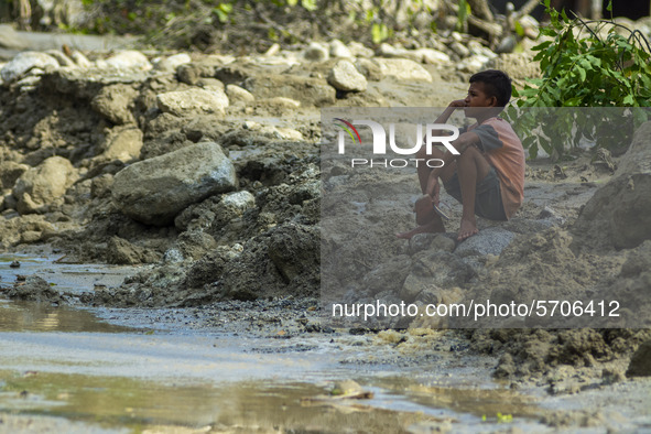 A child is in his former home that was lost in a flash flood in Poi Village, South Dolo Subdistrict, Sigi Regency, Central Sulawesi Province...