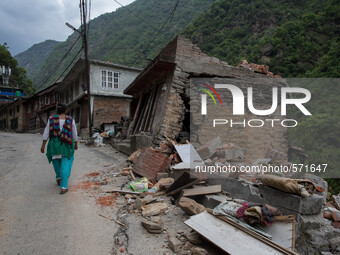 A woman pass through destroyed houses on the Araniko Road near the Kobani Village (Tibetan Border).
Isolated Nepalese Villagers still waitin...
