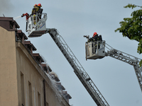 A view of a fire scene with emergency services in action.
Over 50 firemen took part in a firefighting operation in the center of Krakow, jus...
