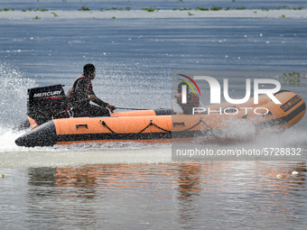 National Disaster Response Force (NDRF) jawan patrol in the Brahmaputra river, during the ongoing COVID-19 nationwide lockdown, in Guwahati,...