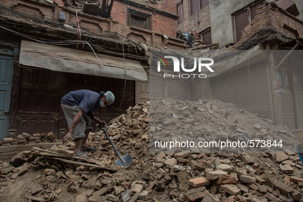 A man is removing rubbles from his house.
2 weeks after the powerful and deadly earthquake, a view of the oldest city in Nepal, Bakhtapur.
T...
