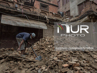 A man is removing rubbles from his house.
2 weeks after the powerful and deadly earthquake, a view of the oldest city in Nepal, Bakhtapur.
T...