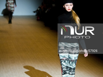 A model presents a creation by Ukrainian designer Elena Golets during the Ukrainian Fashion Week in Kiev, on March 17, 2014. (