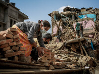 People are cleaning the rubbles in the destroyed buildings. Sankhu, Nepal. May 3, 2015. (