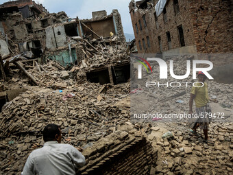 People are cleaning the rubbles in the destroyed buildings. Sankhu, Nepal. May 9, 2015. (