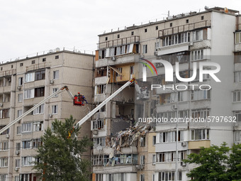 Rescue workers work after a suspected gas explosion in an apartment building in Kiyv, Ukraine, on 21 June 2020. As a result of suspected gas...