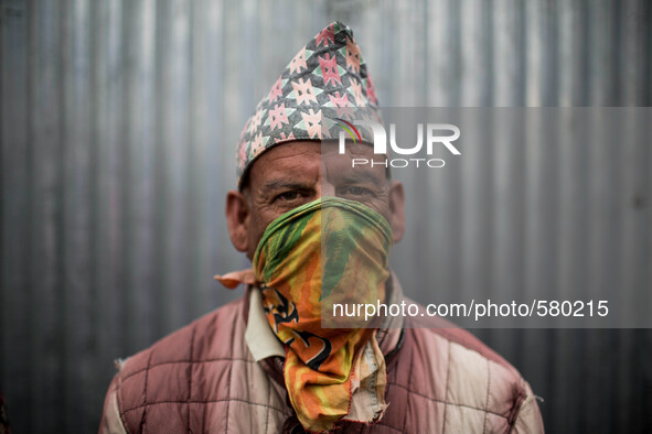 A relative of a dead during the cremation at Pashupatinath Temple, Kathmandu. May 1, 2015. 