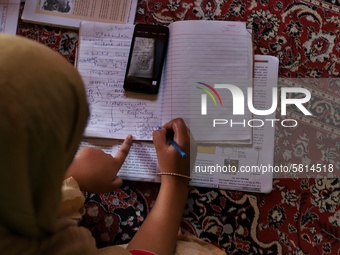 Kashmiri Students take Zoom Classes (online classes) at their home during Covid-19 (Coronavirus) lockdown in Sopore Town of district Baramul...