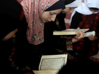 Girls attend a Koran memorization class as Palestinians ease the coronavirus disease (COVID-19) restrictions, in a mosque in Gaza City June...