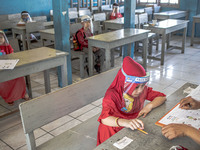 A little girl during her psychological test for selection entering the school at Depok, West Java, Indonesia, on July 6, 2020.  The Educatio...
