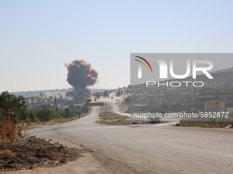 Smoke rises on the Aleppo-Latakia highway near the city of Jericho in northwestern Syria on July 14, 2020, due to a car bomb explosion while...