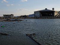 March 18, 2011-Rikuzen Takata, Japan-View of Flooding stadium at Debris and Mud covered on Tsunami hit Destroyed city in Rikuzentakata on Ma...