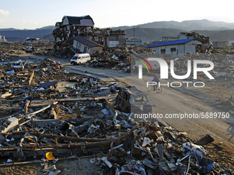 March 18, 2011-Rikuzen Takata, Japan-Native Survivors find their house lot at Debris and Mud covered on Tsunami hit Destroyed city in Rikuze...