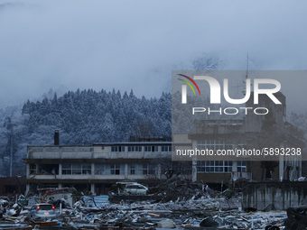 March 24, 2011-Sanriku, Japan-Snow falling on debris and mud covered at Tsunami hit Destroyed empty village in Sanriku on March 24, 2011, Ja...
