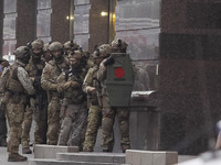 Members of special forces prepare to detain a man who threatens to detonate a bomb at a bank office in center of Kyiv, Ukraine, on 03 August...