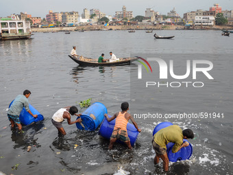 May 17, 2015 - Dhaka, Bangladesh - People are washing plastic drums which had been used to carry toxic chemicals.  (