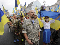 Ukrainian servicemen, veterans of the eastern Ukrainian conflict with Russia-backed separatists, attend an unofficial military parade called...