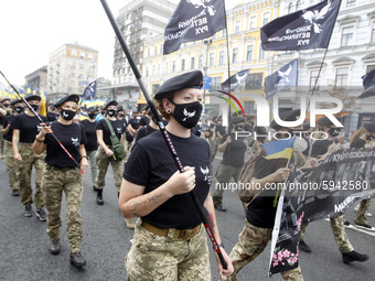 Participants of Women's Veteran Movement attend an unofficial military parade called 'March of Defenders of Ukraine' to mark the Independenc...