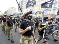 Participants of Women's Veteran Movement attend an unofficial military parade called 'March of Defenders of Ukraine' to mark the Independenc...