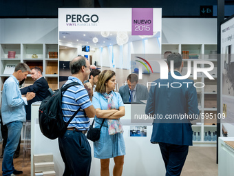 Several people at the stand of the brand Pergo during the Construmat fair in Barcelona on May 19, 2015 (
