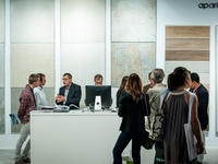 Several people at the stand of Aparici during the Construmat fair in Barcelona on May 19, 2015 (