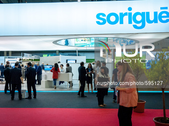 Several people at the stand of Sorigué during the Construmat fair in Barcelona on May 19, 2015 (