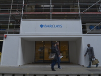 People passing the a branch of Barclays in Manchester on Monday 11th of May 2015. -- Barclays Bank and the Royal Bank of Scotland, as well a...