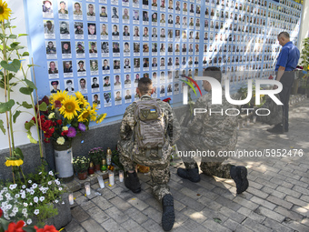The Ukrainian military near Memory Wall of the Fallen Defenders of Ukraine in the war in Eastern Ukraine 2014-2020 during a commemorative ce...