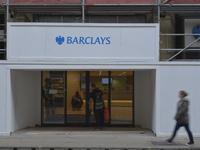 People passing the a branch of Barclays in Manchester on Monday 11th of May 2015. -- Barclays Bank and the Royal Bank of Scotland, as well a...