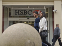 A person passing a branch of the HSBC bank in Manchester on Friday 1st May 2015. (