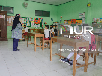 A teacher teach the students in a classroom at Candirejo Elementary School, Semarang Regency, Central Java, Indonesia, on September 1, 2020....