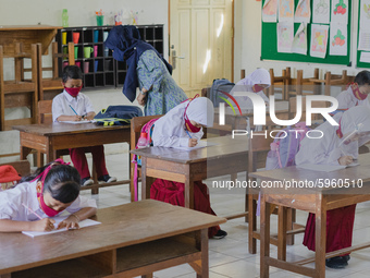 Students do their assignment at Candirejo Elementary School, Semarang Regency, Central Java, Indonesia, on September 1, 2020. Local governme...