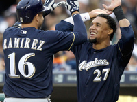 Milwaukee Brewers' Aramis Ramirez #16 is congratulated by Carlos Gomez #27 after his solo home run in the third inning of a baseball game ag...