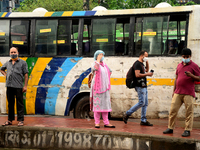 Passenger wearing face mask waits at a Bus Stop for make their travels during the coronavirus pandemic in Dhaka, Bangladesh, on September 1,...