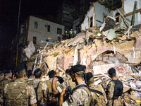 After the authorities  decision to call off the search until Friday morning, a teamn of protesters climed on the destroyed building trying t...